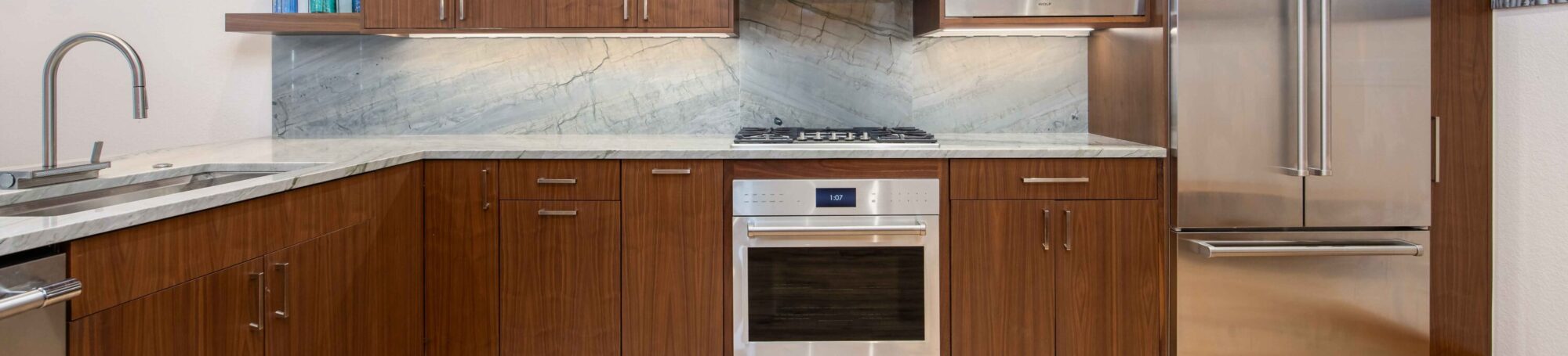 This is a picture of a kitchen featuring the following: Bridgewood, Walnut, Carmel, Scandia V