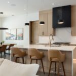 This is a picture of a kitchen in Dillon, CO featuring White Oak cabinetry fabricated by Bridgewood Cabinetry.