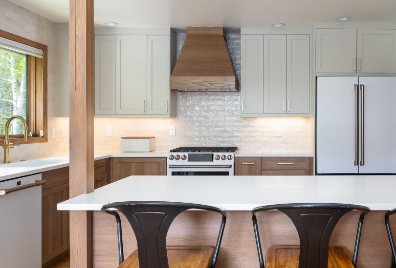 Cashmere Lower Cabinetry; Accessible Beige Uppers Kitchen Remodel by Creative Cabinetry project photo