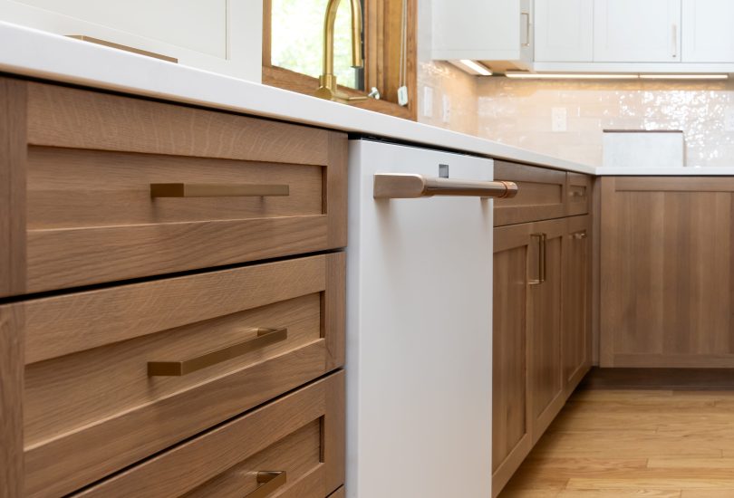 Cashmere Lower Cabinetry; Accessible Beige Uppers Kitchen Remodel by Creative Cabinetry project photo 2
