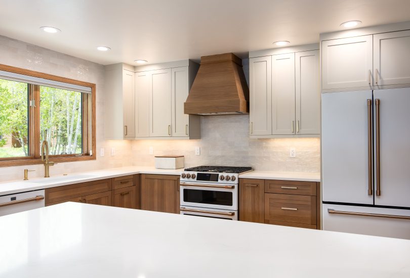 Cashmere Lower Cabinetry; Accessible Beige Uppers Kitchen Remodel by Creative Cabinetry project photo 4