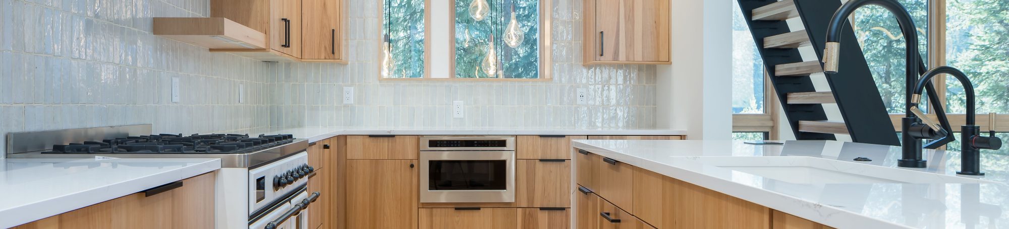 This is a picture of a kitchen featuring Bridgewood Cabinetry: Hickory, Natural stain, Scandia door style.