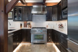 Knotty Alder kitchen cabinetry in Koala stain by Bridgewood Cabinetry