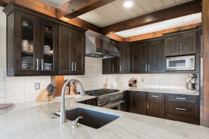 Knotty Alder kitchen cabinetry in Koala stain by Bridgewood Cabinetry